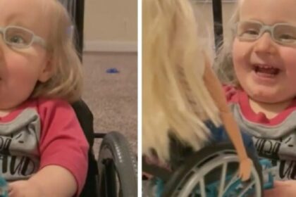 Meisje 2 met open ruggetje krijgt bijzondere barbie en straalt van geluk